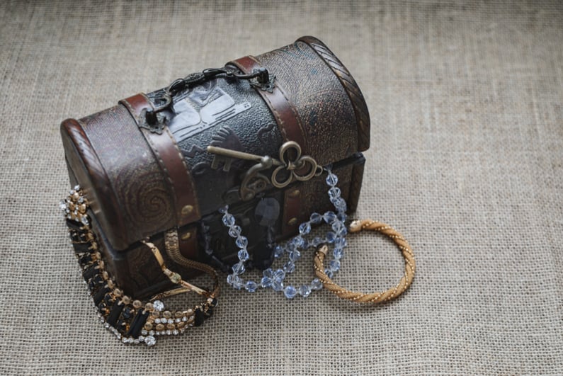 Vintage loot box, open treasure chest on sackcloth background