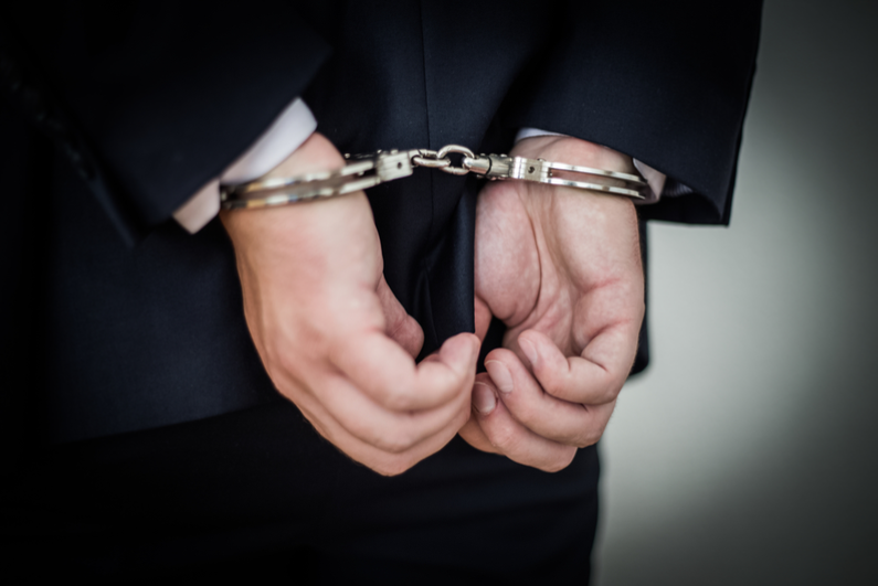 Businessman in handcuffs