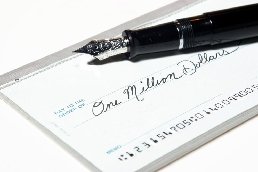 check for one million dollars and fountain pen