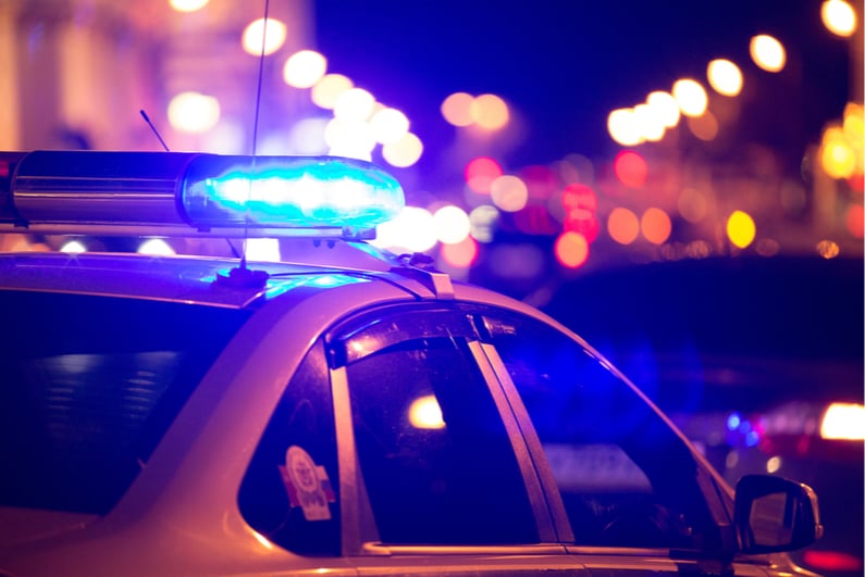 Blue light on top of a police car