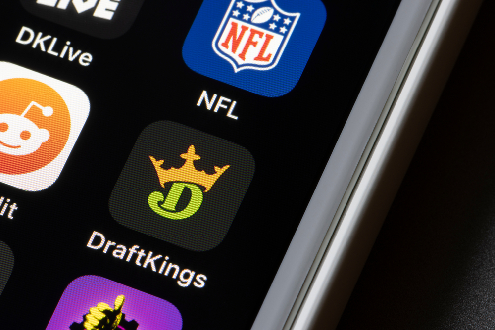 DraftKings logo on phone screen