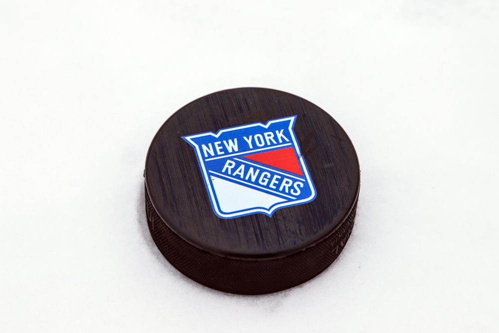 ice hockey puck with New York Rangers logo